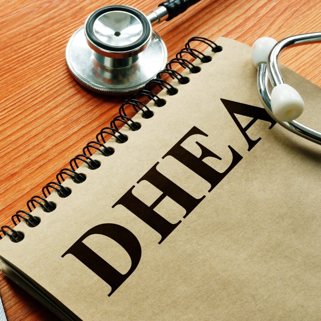 Notepad with "DHEA" and a stethoscope